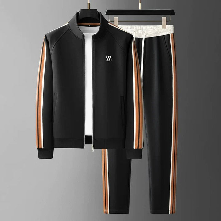 Men's Manor athleisure tracksuit featuring a modern zip-up jacket & comfortable trousers. Ideal for active lifestyles.