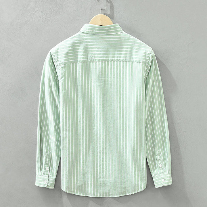 Casual men's striped button-up shirt, perfect for a relaxed yet modern summer style.