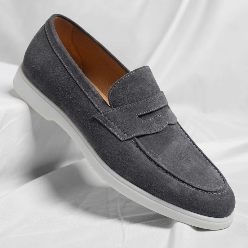 Sleek men's penny loafers. Mayfair design, elegant slip-on dress shoes for stylish comfort.