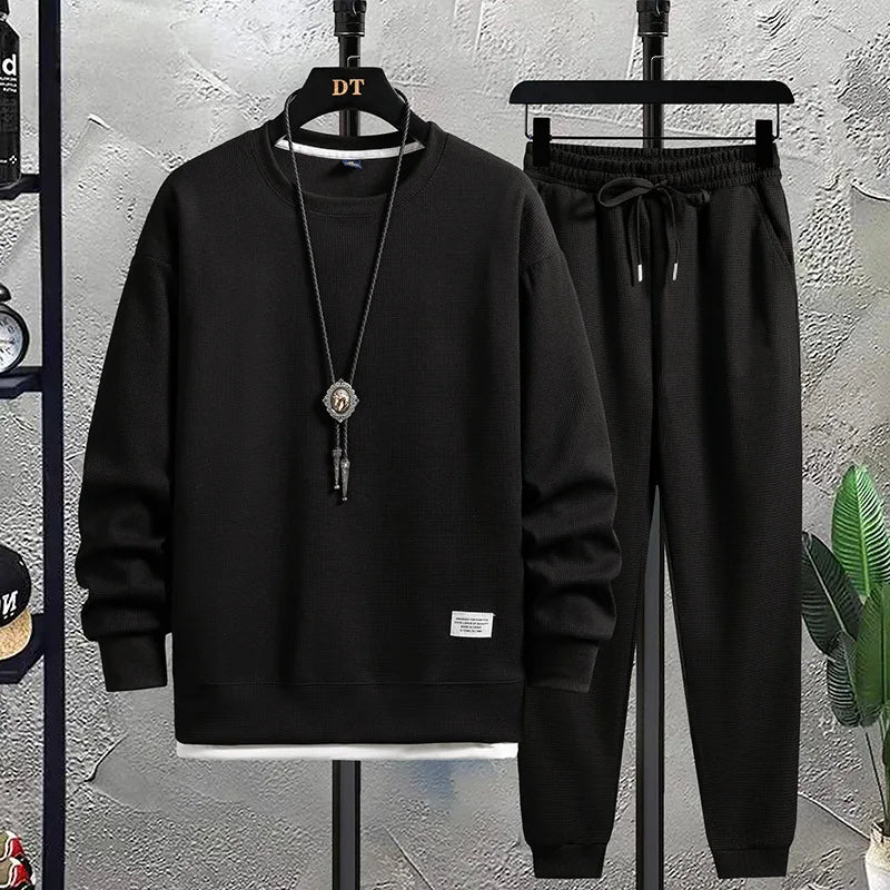 Relaxed fit men's joggers & crewneck top, a comfortable two-piece lounge set for leisure.