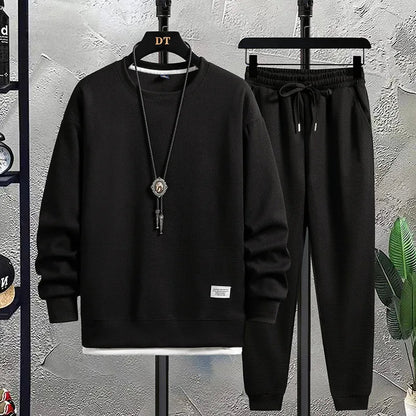Relaxed fit men's joggers & crewneck top, a comfortable two-piece lounge set for leisure.