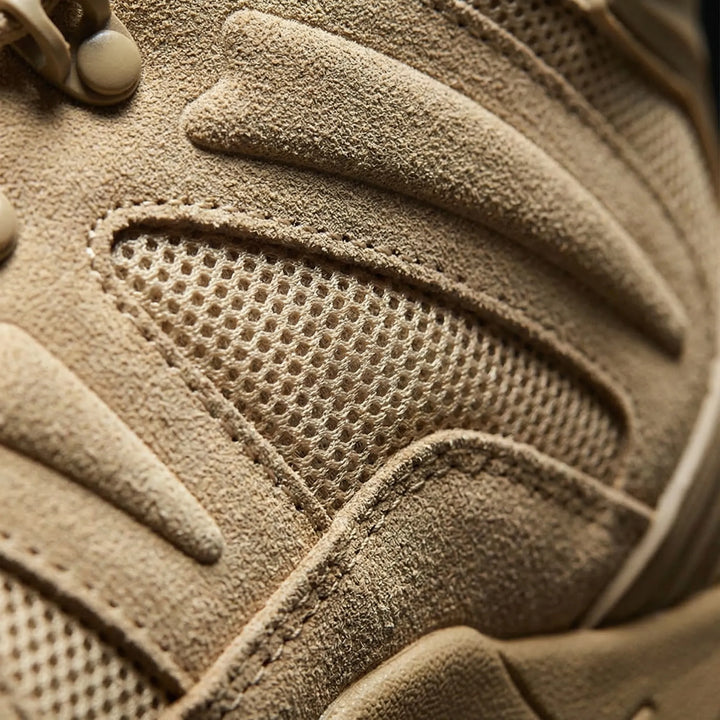Lace-up men's mid-cut hiking boots providing strong ankle support for rugged outdoor trail adventures.
