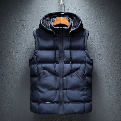 Men's Midtown Hooded Puffer Vest in black. Insulated, lightweight, and weather-ready for autumn & winter layering.