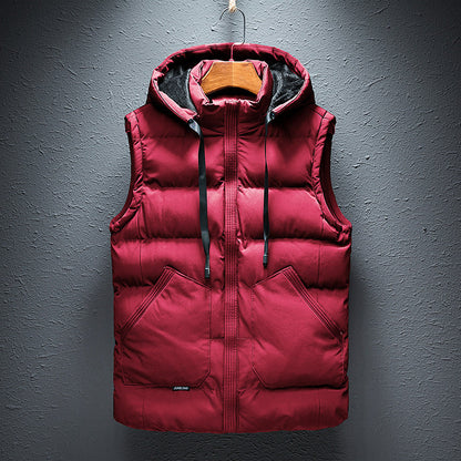 Zip-up men's insulated puffer vest with hood. Ideal lightweight outerwear for warmth, perfect for winter or autumn.