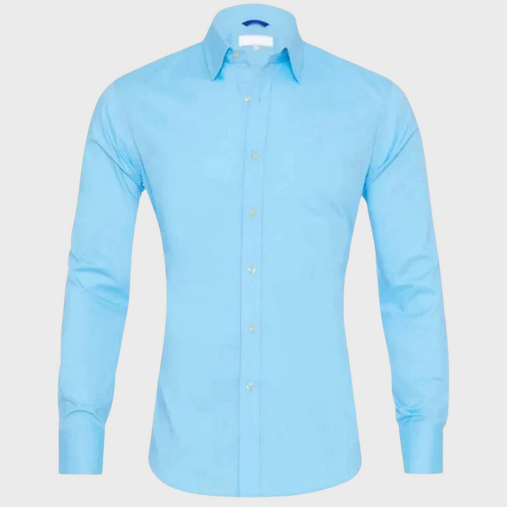 Man wearing a crisp Milan wrinkle-free shirt in an office setting, exuding professional men's style.