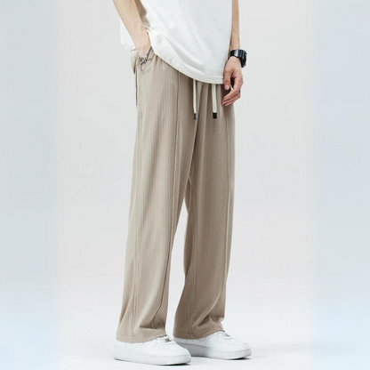 Comfortable men's Milano pleated casual trousers with elastic waist, perfect for everyday style.
