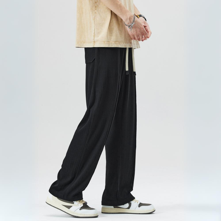 Modern men's Milano pleated casual pants, elastic waist, combining comfort and sophisticated style.