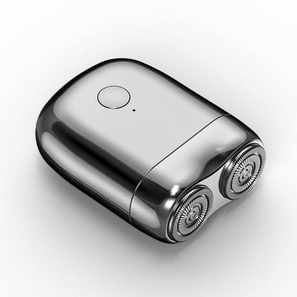 Portable men's electric razor, rechargeable & waterproof, ideal for travel & personal care.