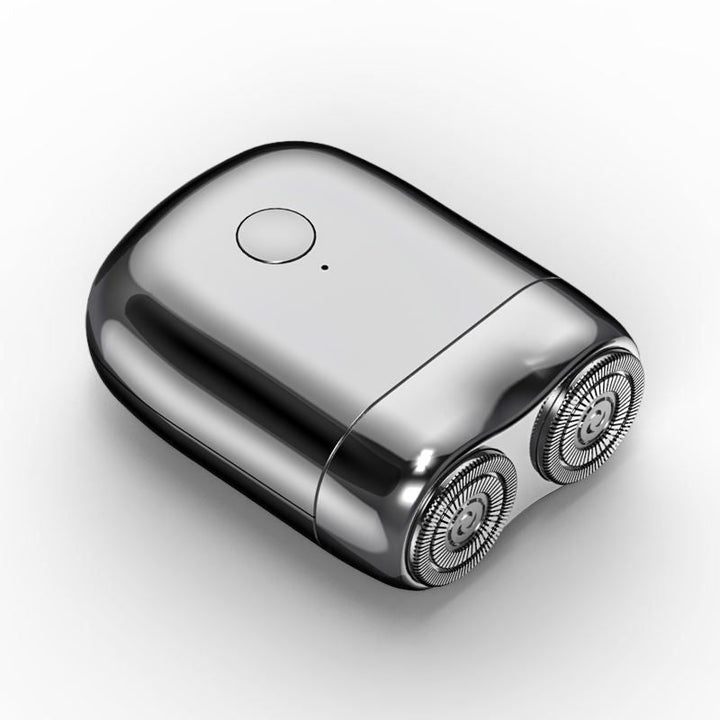 Portable men's electric razor, rechargeable & waterproof, ideal for travel & personal care.