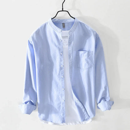 Modern men's minimal band collar shirt in a relaxed fit. Ideal for casual summer days or smart casual events.