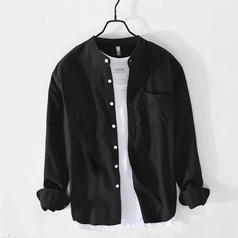Lightweight men's button-down shirt with a minimalist band collar. Effortless style, relaxed fit for summer comfort.