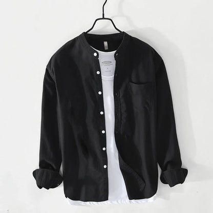 Lightweight men's button-down shirt with a minimalist band collar. Effortless style, relaxed fit for summer comfort.