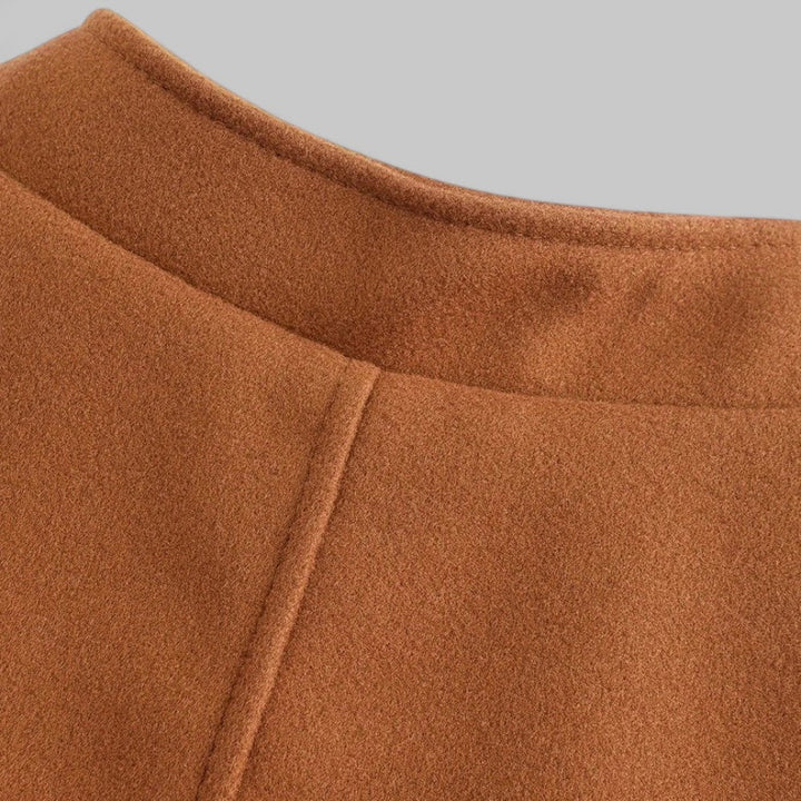 Modern men's winter coat, featuring a minimalist button design and tailored smart casual look.