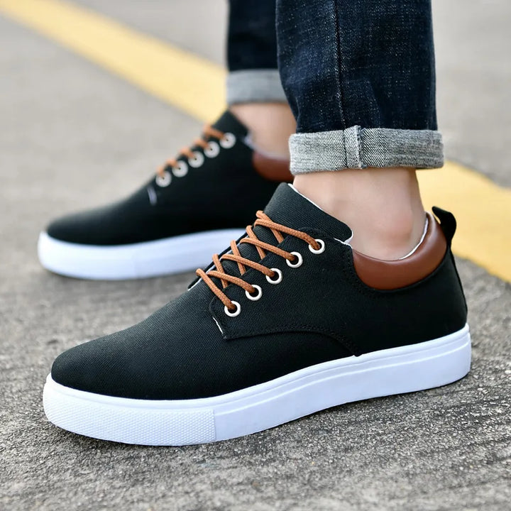 Sleek black men's minimalist slip-on casual dress shoes for comfortable everyday and formal fashion.