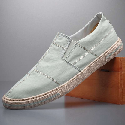 Breathable men's casual slip-on shoes, lightweight design, modern art style.