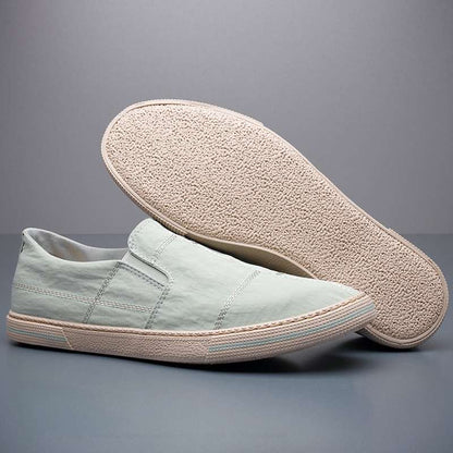 Stylish men's lightweight slip-on footwear, modern art pattern, casual & comfortable.