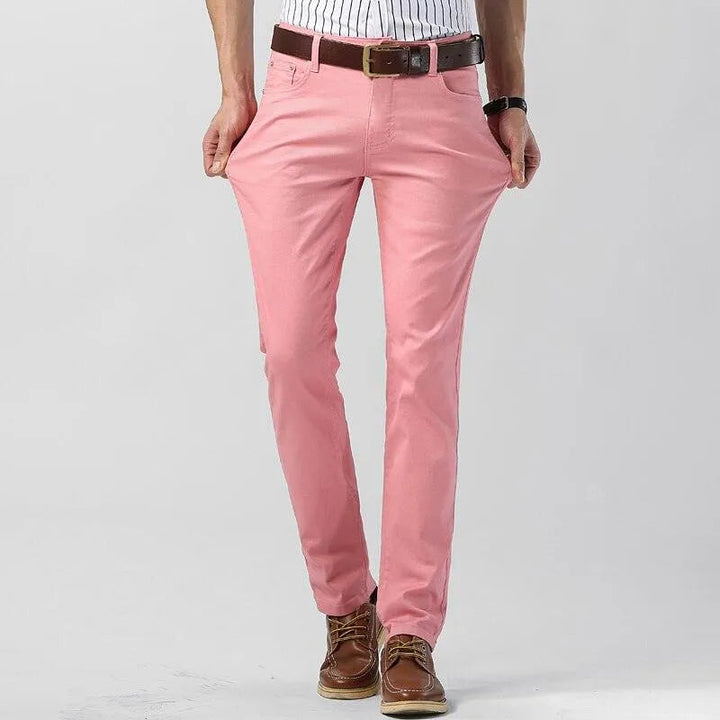 Stylish men's pink trousers, modern fit, versatile cotton blend for casual and smart casual outfits.