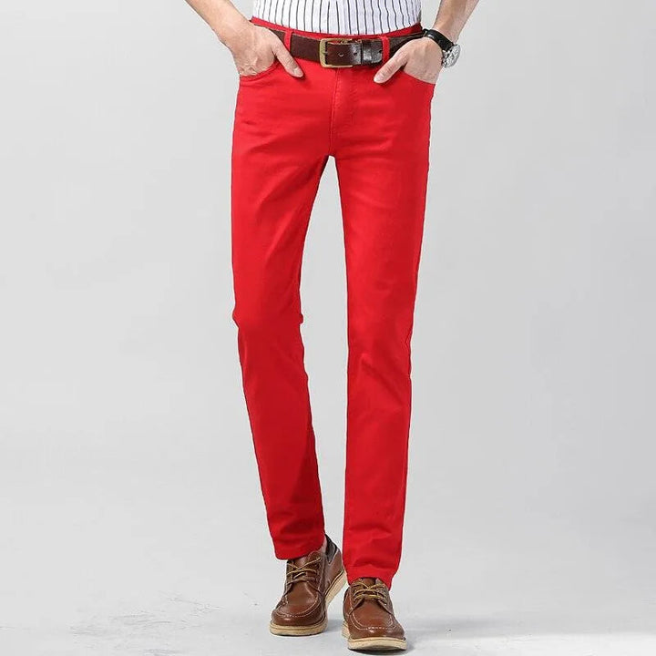 Close-up of men's colored cotton blend trousers, showing modern fit and quality fabric for all-season comfort.