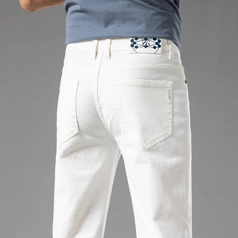 Men's modern fit stretch denim jeans in a classic blue wash, perfect for casual everyday wear.