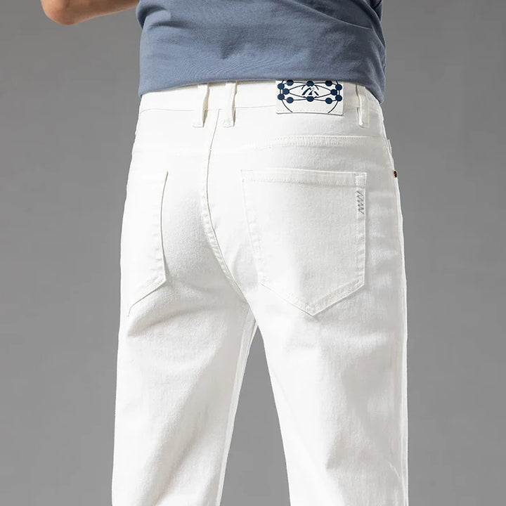 Men's modern fit stretch denim jeans in a classic blue wash, perfect for casual everyday wear.