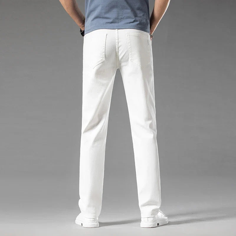 Clean white men's modern fit stretch denim jeans, a fresh option for contemporary casual outfits.