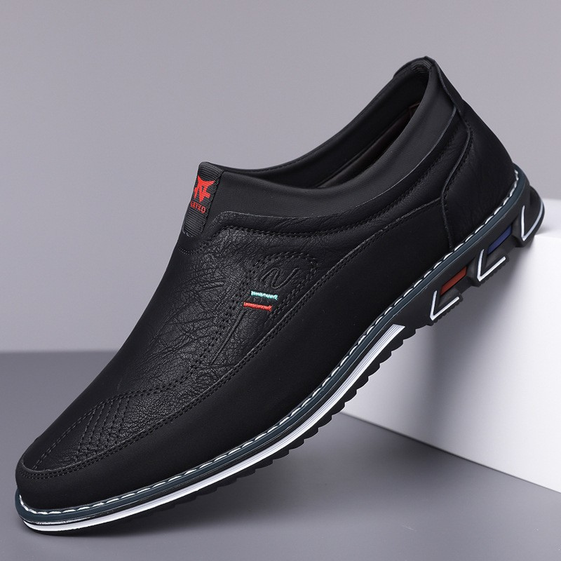 Dark men's modern hybrid loafers, cushioned dress shoes ideal for professional office style.