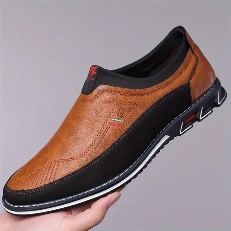 Side view of men's slip-on loafers. Cushioned comfort dress shoes for modern casual and office wear.