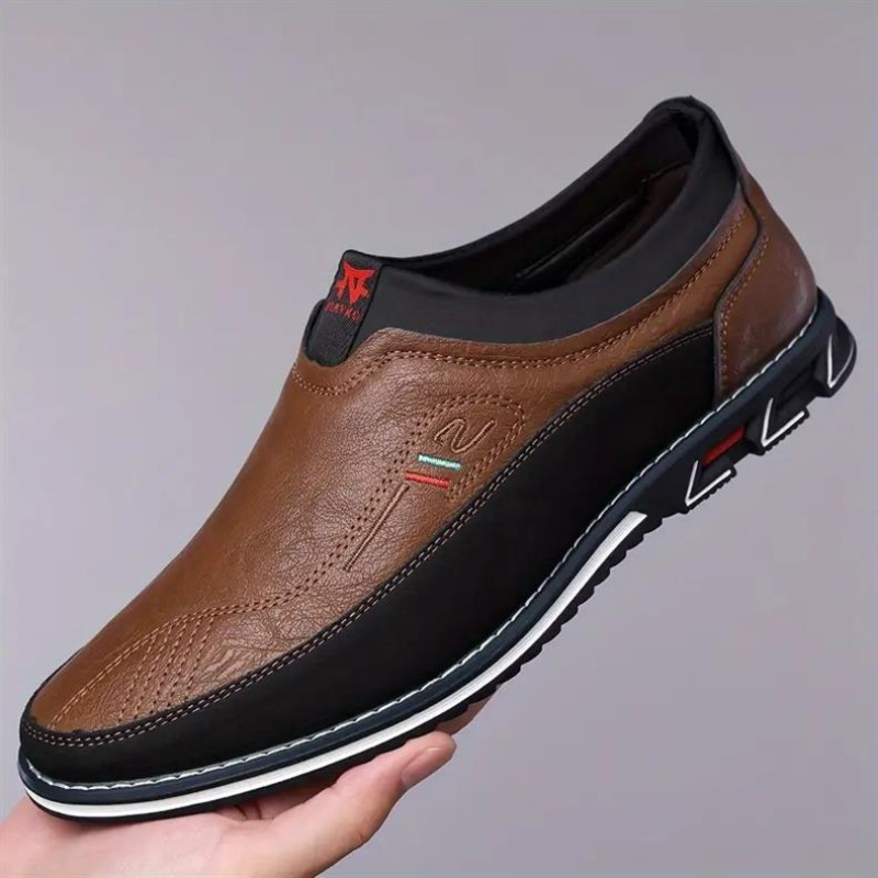 Men's modern dress loafers on foot, providing cushioned comfort for office wear & smart casual.