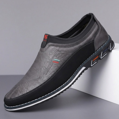 Pair of versatile men's hybrid loafers, blending dress shoe elegance with slip-on comfort.