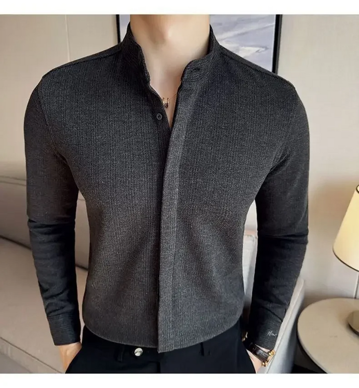Casual black men's mandarin collar button-up shirt. Modern long sleeve design for versatile men's apparel.