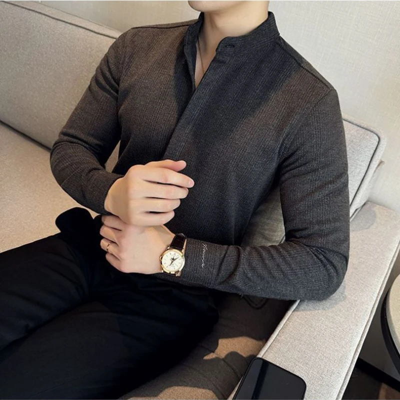 Sophisticated men's coffee mandarin collar button-up shirt. Tailored long sleeve modern men's fashion.