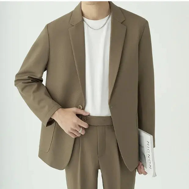 Men's modern minimalist two-piece suit for sophisticated formal events, business, or office wear.