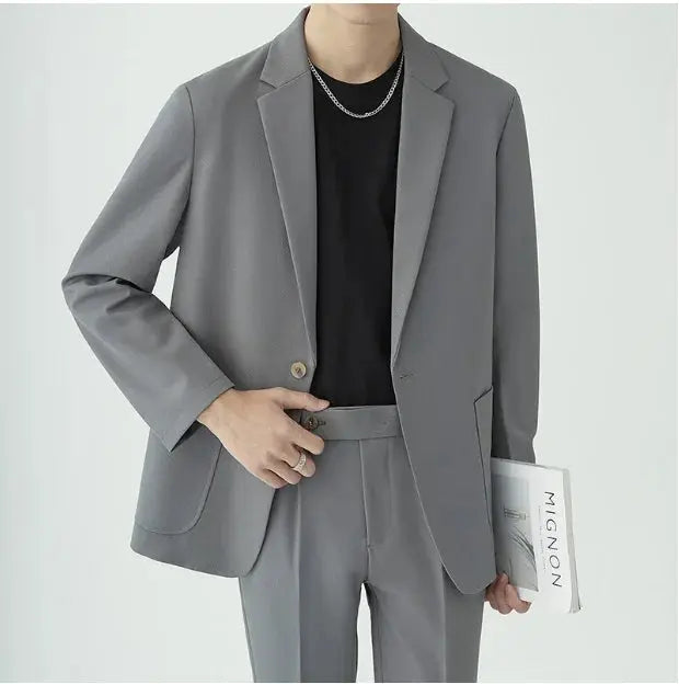 Tailored men's two-piece suit, featuring a minimalist style for formal wear and special occasions.