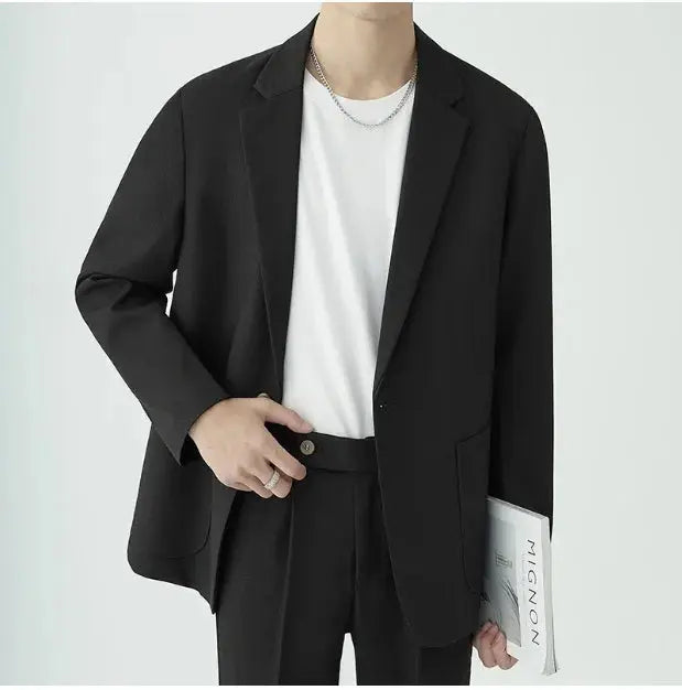 Elegant men's formal suit with a modern, minimalist two-piece design, ideal for any special occasion.