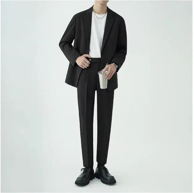 High-quality men's two-piece suit in minimalist style, perfect formal attire for sophisticated events.