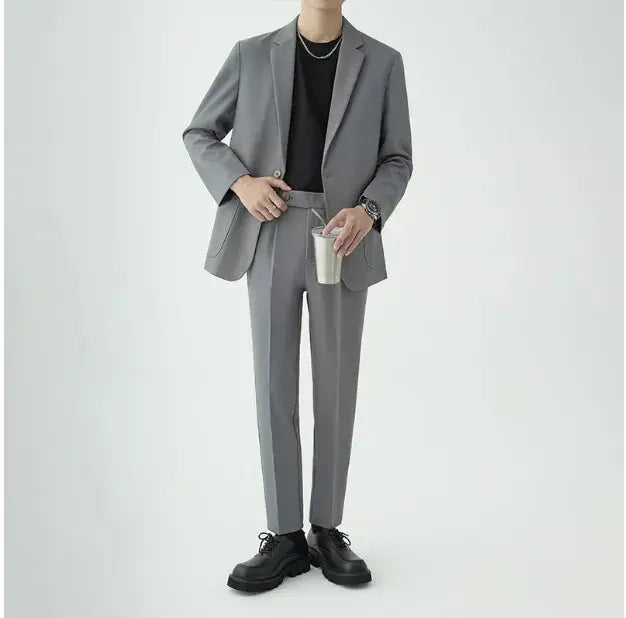 Modern men's two-piece suit, showcasing sophisticated minimalist style for formal business and event attire.