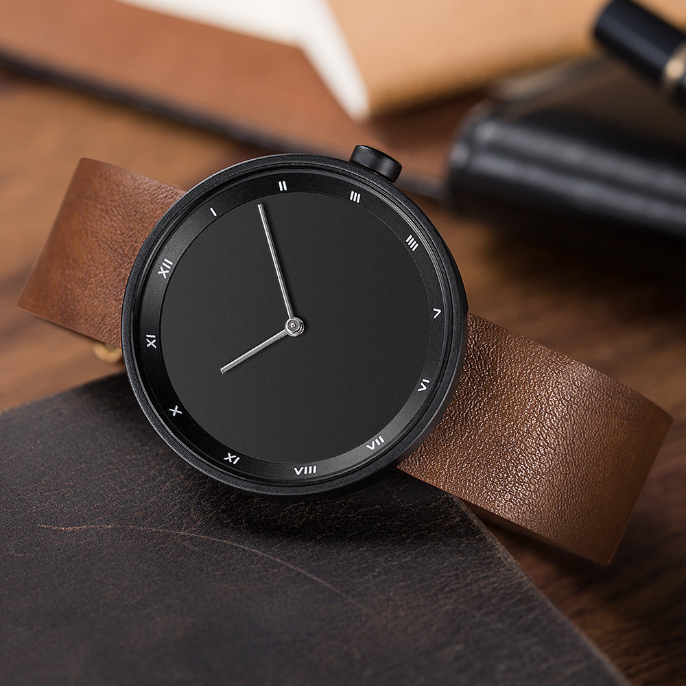Sleek men's quartz watch, water-resistant, featuring an elegant roman numeral dial.