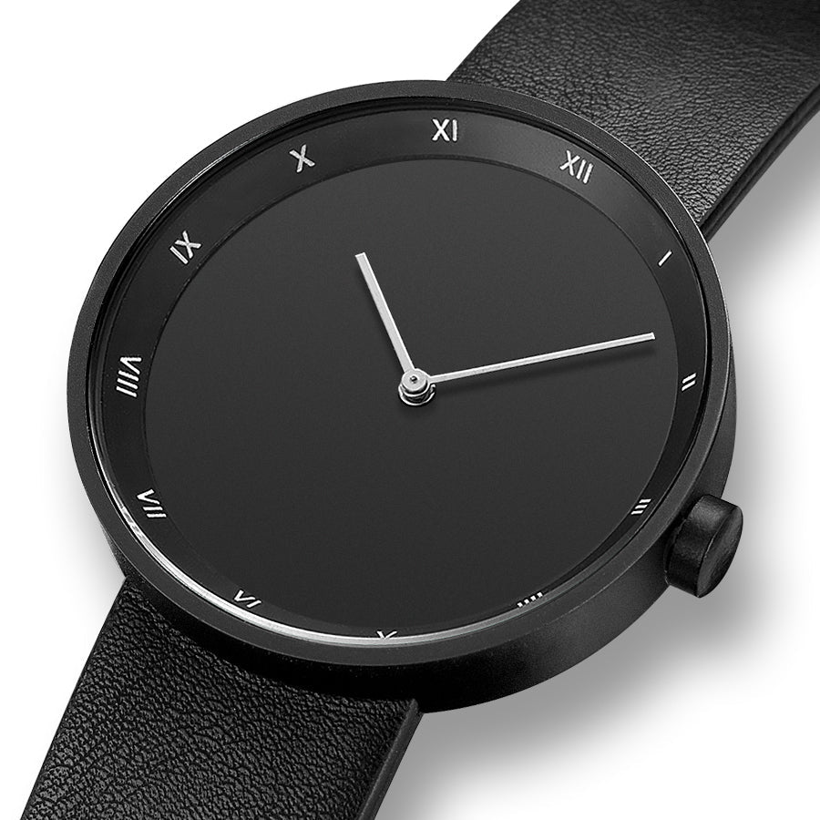 Men's sleek watch with a refined black dial, silver hands, and distinct Roman numeral hour markers.