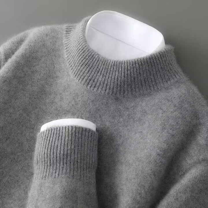 Men's refined mock neck pullover sweater. Comfortable long sleeve design, ideal for autumn & winter elegance.