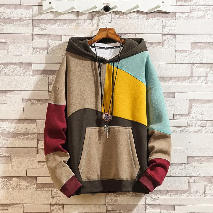 Stylish men's patchwork hoodie with a unique mixed-fabric design. A modern hooded sweatshirt for fashion-forward streetwear.
