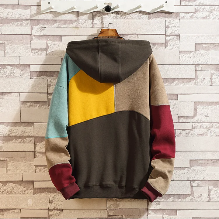 Standout men's patchwork hoodie. Modern pullover with unique fabric panels, offering comfort and streetwear style.