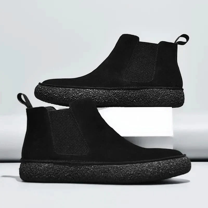 Front view of men's stylish modern Chelsea boots, showcasing a smart look & quality craftsmanship.