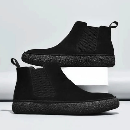 Front view of men's stylish modern Chelsea boots, showcasing a smart look & quality craftsmanship.