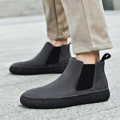 Black men's modern Chelsea dress boots, elegant & stylish footwear for sophisticated looks.