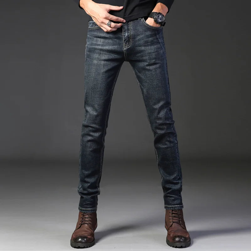 Men's modern slim fit jeans in washed gray, offering a polished and comfortable look. Stretch fabric.