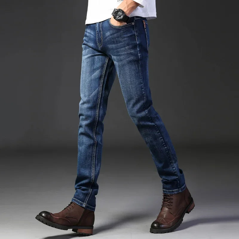 Polished men's modern slim fit jeans, ideal for casual wear. Washed blue, stretch denim, comfortable.