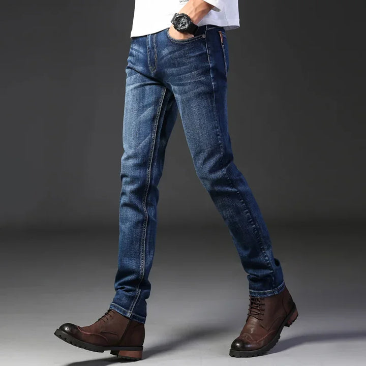 Polished men's modern slim fit jeans, ideal for casual wear. Washed blue, stretch denim, comfortable.