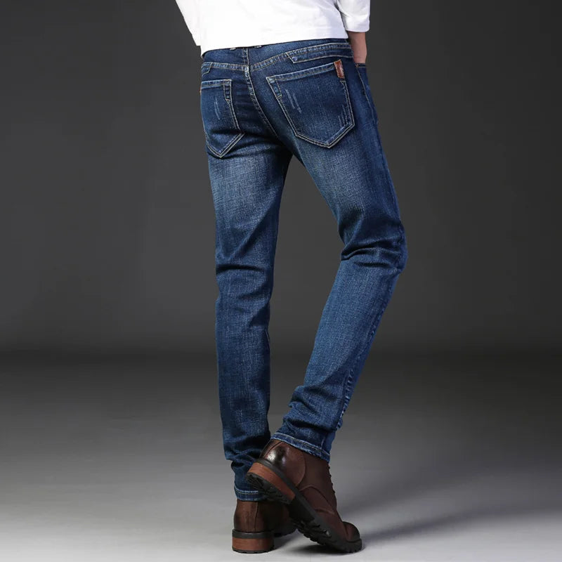 Versatile men's slim fit jeans, washed gray, offering comfort & style for everyday modern looks.