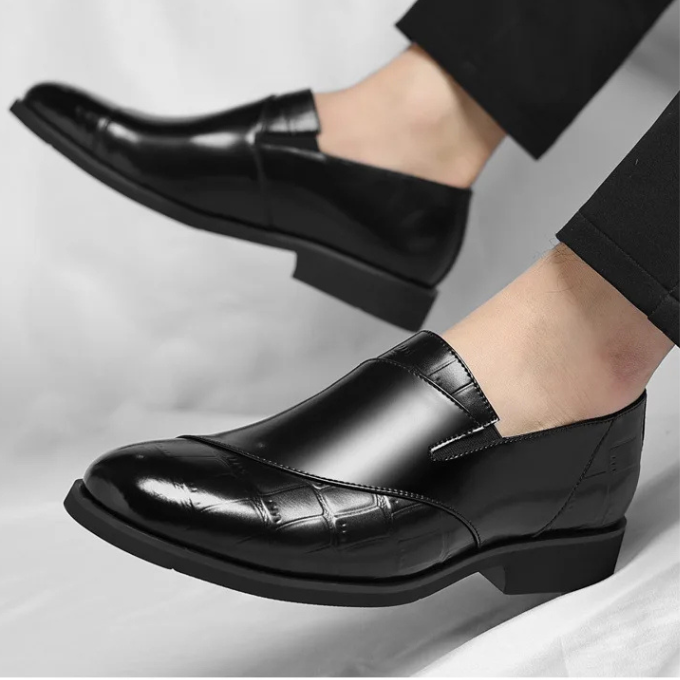 Elegant black men's slip-on loafers with a modern profile for sophisticated comfort.