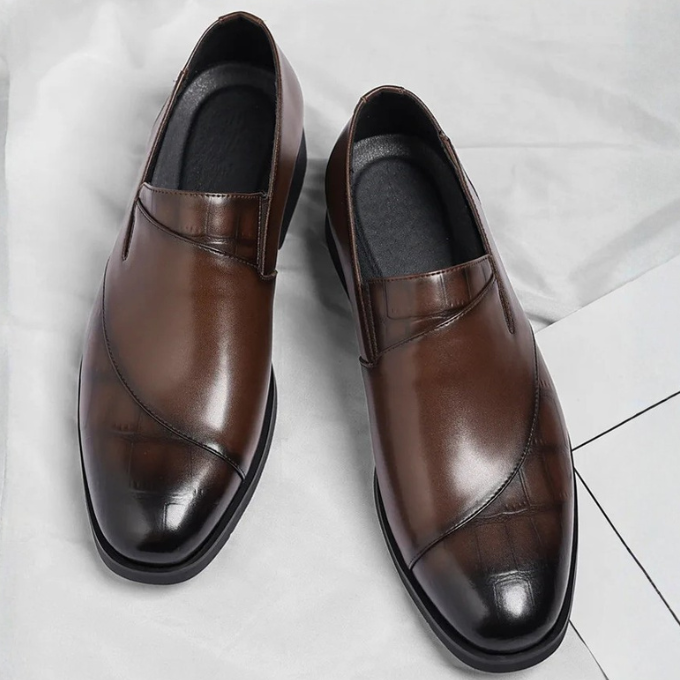Stylish men's formal slip-on loafers in a sleek modern design for everyday comfort.